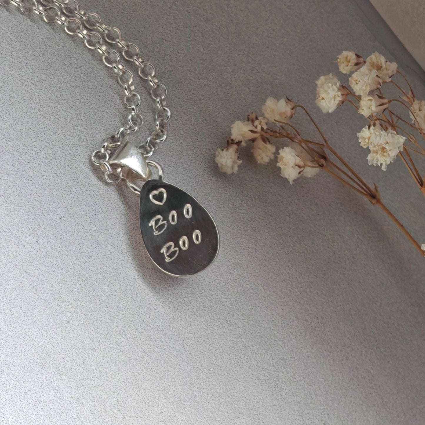 Pet hair memorial keepsake necklace.